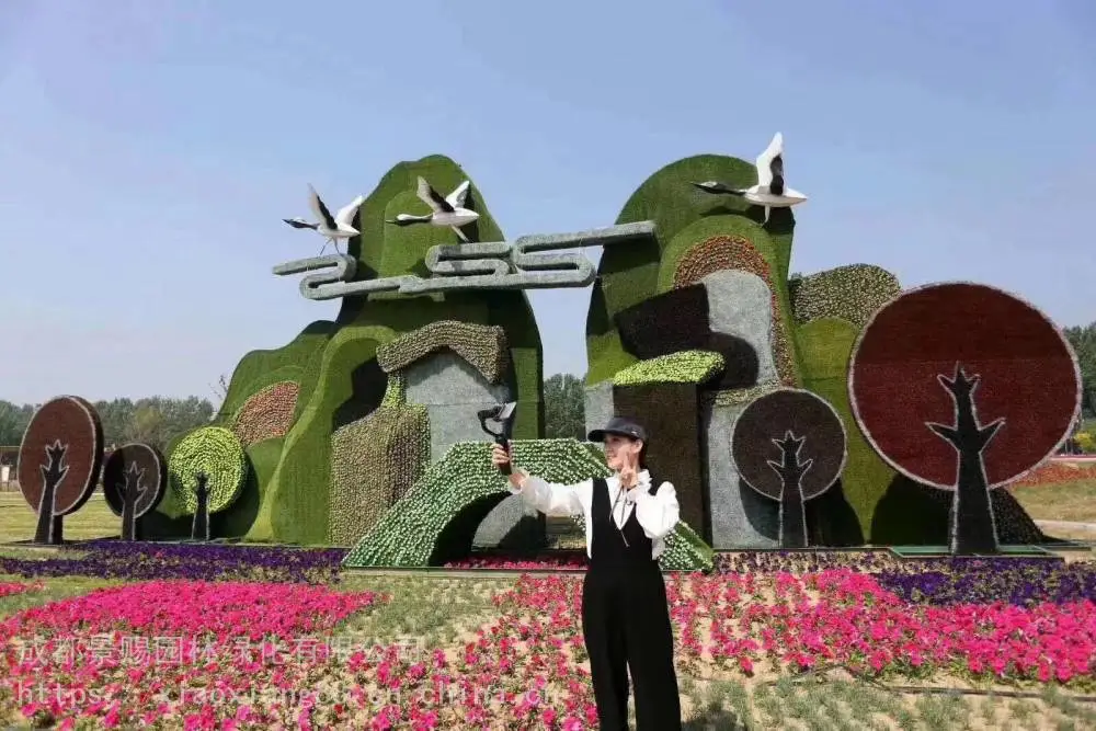 四川资阳绿雕设计素材 ,一帆风顺造型花雕景赐雕塑仿真绿雕定制
