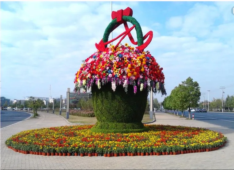 云南西双版纳仿真春节绿雕设计立体花坛的仿真春节绿雕立体花坛