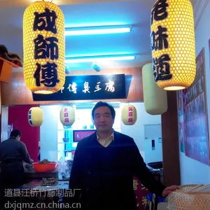 江桥竹藤生态装饰灯笼厂家为全国餐饮酒店客栈专业批发定做包布印字防雨装饰景观吊挂灯笼