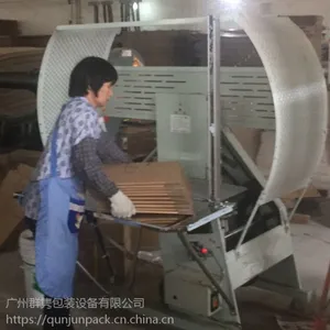 厂家常年供应群隽牌100型无纺布打包机?纸箱包装捆扎机?布匹服装捆包机