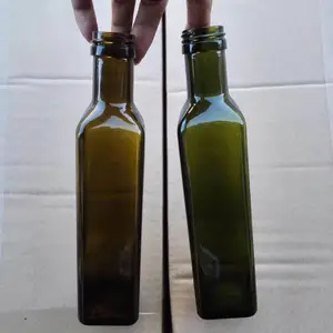 徐州出口玻璃瓶厂家直销500ml翠绿色丝印压口玻璃橄榄油瓶配套塑料瓶盖