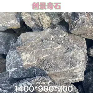 山东菏泽黑山石草坪造型 菏泽黑山石绿化点缀 菏泽黑山石观赏石案例