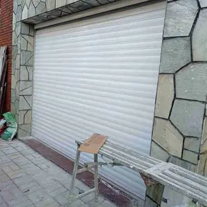 东莞樟木头卷闸门遥控器配对 铁拉门维修更换弹簧 双喜门业