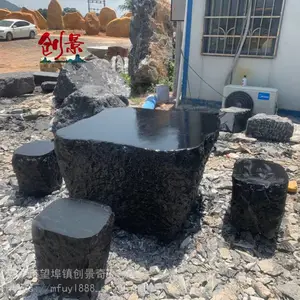 户外石桌子图片及价格，黑色石头公园摆放石，黑山石的用途很多
