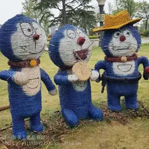 轮胎工艺品的制作过程 景观雕塑手绘 稻草工艺品图片