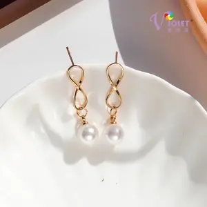 甜美金属几何珍珠蝴蝶结耳环