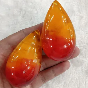 二代高仿人造蜜蜡原石荧光浮盐水琥珀吊坠展销会旅游景点热销产品义乌饰品批发