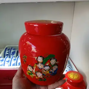 红色的陶瓷罐子 结婚用装红枣陶瓷坛子 喜字小孩图案 瓷坛罐生产厂家