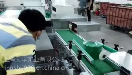 新一代筒子纱全自动包装机,上海天孚筒子纱自动封膜机介绍