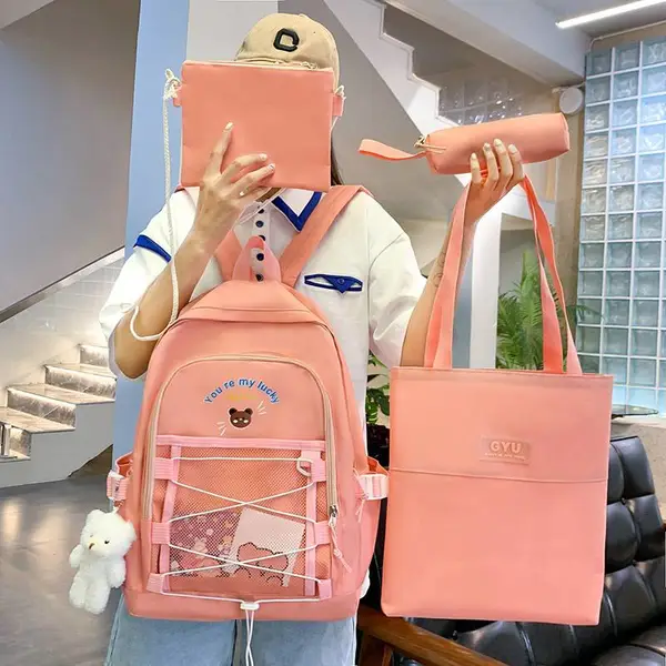 厂家批发韩版少女双肩包卡通小熊小学生书包补课袋四件套初中背包