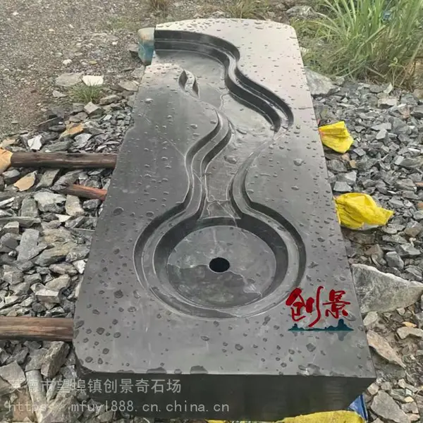 枯山水黑山石点缀-中国黑山石石材厂家-园林黑山石驳岸案例